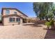 Private backyard with desert landscaping, covered patio and view of the home's architecture at 33512 N 24Th Ln, Phoenix, AZ 85085