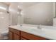 Bathroom featuring double sinks, wood cabinets and a shower-tub combo at 33512 N 24Th Ln, Phoenix, AZ 85085