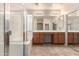 Bright bathroom with double sinks, vanity, and separate shower and tub at 33512 N 24Th Ln, Phoenix, AZ 85085