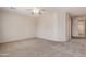 Spacious carpeted bedroom with ceiling fan and window views at 33512 N 24Th Ln, Phoenix, AZ 85085