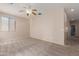 Carpeted bedroom with natural light from windows and ceiling fan at 33512 N 24Th Ln, Phoenix, AZ 85085