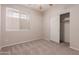 Neutral bedroom with carpet, ceiling fan, and closet at 33512 N 24Th Ln, Phoenix, AZ 85085