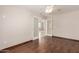 A bedroom with an open door, hardwood floors, and a ceiling fan at 33512 N 24Th Ln, Phoenix, AZ 85085