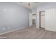 Bedroom featuring neutral carpet, fan, and closet at 33512 N 24Th Ln, Phoenix, AZ 85085