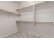 Empty walk-in closet with plenty of space for storage at 33512 N 24Th Ln, Phoenix, AZ 85085