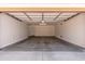 Spacious garage with concrete floor and interior door at 33512 N 24Th Ln, Phoenix, AZ 85085