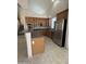Spacious kitchen featuring a large island, stainless steel appliances, and tile flooring at 33512 N 24Th Ln, Phoenix, AZ 85085