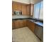 Kitchen area with stainless steel appliances and natural light from a window at 33512 N 24Th Ln, Phoenix, AZ 85085