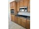 Close-up view of the kitchen with built-in oven, microwave, and gas cooktop at 33512 N 24Th Ln, Phoenix, AZ 85085