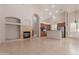 Open kitchen concept with stone fireplace, stainless steel appliances and breakfast bar at 33512 N 24Th Ln, Phoenix, AZ 85085