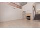 Spacious living room area with a stone fireplace, high ceilings, and open floor at 33512 N 24Th Ln, Phoenix, AZ 85085