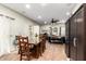 Spacious dining room with dining table and chairs, connecting to the game room with entertainment options at 33602 N Cobble Stone Dr, San Tan Valley, AZ 85143
