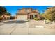 Inviting two-story home features a well-manicured front yard and an attached two-car garage at 33602 N Cobble Stone Dr, San Tan Valley, AZ 85143