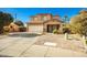 Inviting two-story home features a well-manicured front yard and an attached two-car garage at 33602 N Cobble Stone Dr, San Tan Valley, AZ 85143