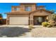 Charming two-story home boasts a two-car garage and a cozy covered porch at 33602 N Cobble Stone Dr, San Tan Valley, AZ 85143