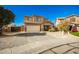 Inviting two-story home features a well-manicured front yard and an attached two-car garage at 33602 N Cobble Stone Dr, San Tan Valley, AZ 85143