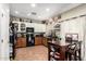 Kitchen with upper white cabinets and lower wood cabinets, granite countertops, and stainless steel appliances at 33602 N Cobble Stone Dr, San Tan Valley, AZ 85143