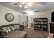 Open living room with carpet, adjacent hallway and view into a bathroom with a vanity at 33602 N Cobble Stone Dr, San Tan Valley, AZ 85143