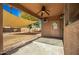 View of covered patio leading to spacious backyard with sunshade and landscaping at 33602 N Cobble Stone Dr, San Tan Valley, AZ 85143