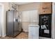 Functional storage area with a stainless steel refrigerator and a deep freezer at 33602 N Cobble Stone Dr, San Tan Valley, AZ 85143