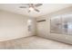 Bedroom with neutral walls, carpet flooring, ceiling fan and natural light from two windows at 3500 N Hayden Rd # 710, Scottsdale, AZ 85251