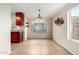 Dining area with tile floor, modern light fixture, and ample natural light at 3500 N Hayden Rd # 710, Scottsdale, AZ 85251