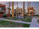 Beautifully maintained condo community with fountain, palm trees, and manicured lawn at 3500 N Hayden Rd # 710, Scottsdale, AZ 85251