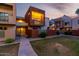 Cozy condo exterior featuring well-maintained lawn and private balcony with decorative lattice at 3500 N Hayden Rd # 710, Scottsdale, AZ 85251