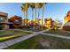 Condo community featuring well-maintained lawn and garden areas and mature shade trees at 3500 N Hayden Rd # 710, Scottsdale, AZ 85251