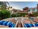Outdoor fire pit and lounge area with seating surrounded by lush landscaping in a well-maintained community at 3500 N Hayden Rd # 710, Scottsdale, AZ 85251