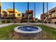 Attractive water fountain as focal point with surrounding landscaped condo community at 3500 N Hayden Rd # 710, Scottsdale, AZ 85251