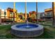 Close up shot of the tiled water fountain and surrounding condo buildings in complex at 3500 N Hayden Rd # 710, Scottsdale, AZ 85251