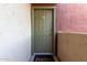 Front door with green door, apartment number 710 and welcome mat at 3500 N Hayden Rd # 710, Scottsdale, AZ 85251