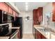 Functional kitchen featuring stainless steel appliances, granite countertops, and ample cabinet space at 3500 N Hayden Rd # 710, Scottsdale, AZ 85251