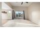 Spacious living room with a sliding glass door to the balcony, bright carpet, and vaulted ceiling at 3500 N Hayden Rd # 710, Scottsdale, AZ 85251
