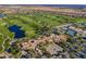 Expansive aerial view featuring golf courses, lakes, tennis courts, and the community clubhouse at 35486 N Morello Dr, Queen Creek, AZ 85140