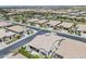 Wide aerial view of homes with swimming pools, green spaces, and well-maintained streets at 35486 N Morello Dr, Queen Creek, AZ 85140