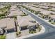 Stunning aerial view of a well-maintained home with a three car garage and beautiful landscaping at 35486 N Morello Dr, Queen Creek, AZ 85140
