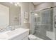 Modern bathroom featuring black and white patterned tile in the shower, and a framed glass shower door at 35486 N Morello Dr, Queen Creek, AZ 85140