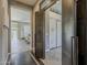 Modern entryway featuring decorative sliding wooden door and access to the living area and closets at 35486 N Morello Dr, Queen Creek, AZ 85140