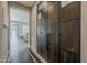 Elegant entryway featuring a large decorative sliding wood door and views of the living area at 35486 N Morello Dr, Queen Creek, AZ 85140