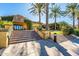 Community clubhouse showcasing the stone accents, beautiful landscaping, and inviting entrance at 35486 N Morello Dr, Queen Creek, AZ 85140
