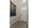 Bright foyer with decorative tile flooring and a stylish, modern front door at 35486 N Morello Dr, Queen Creek, AZ 85140