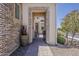 Inviting entrance featuring a decorative brick archway and views of the interior at 35486 N Morello Dr, Queen Creek, AZ 85140
