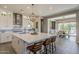 Bright, open kitchen with oversized island, pendant lighting and stainless steel appliances at 35486 N Morello Dr, Queen Creek, AZ 85140