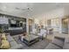 Spacious living room with open concept, and a view into the kitchen and dining area at 35486 N Morello Dr, Queen Creek, AZ 85140