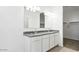 Bathroom features a double sink vanity with granite countertop and modern fixtures at 35941 W San Ildefanso Ave, Maricopa, AZ 85138