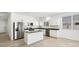 Modern kitchen featuring granite countertops, stainless steel appliances, and ample cabinet space at 35941 W San Ildefanso Ave, Maricopa, AZ 85138