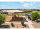 Community park featuring a playground, picnic shelter, and ample green space for outdoor fun and relaxation at 35941 W San Ildefanso Ave, Maricopa, AZ 85138