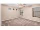 Bedroom with carpeting, ceiling fan, and natural light from window at 3719 W Carson Rd, Phoenix, AZ 85041